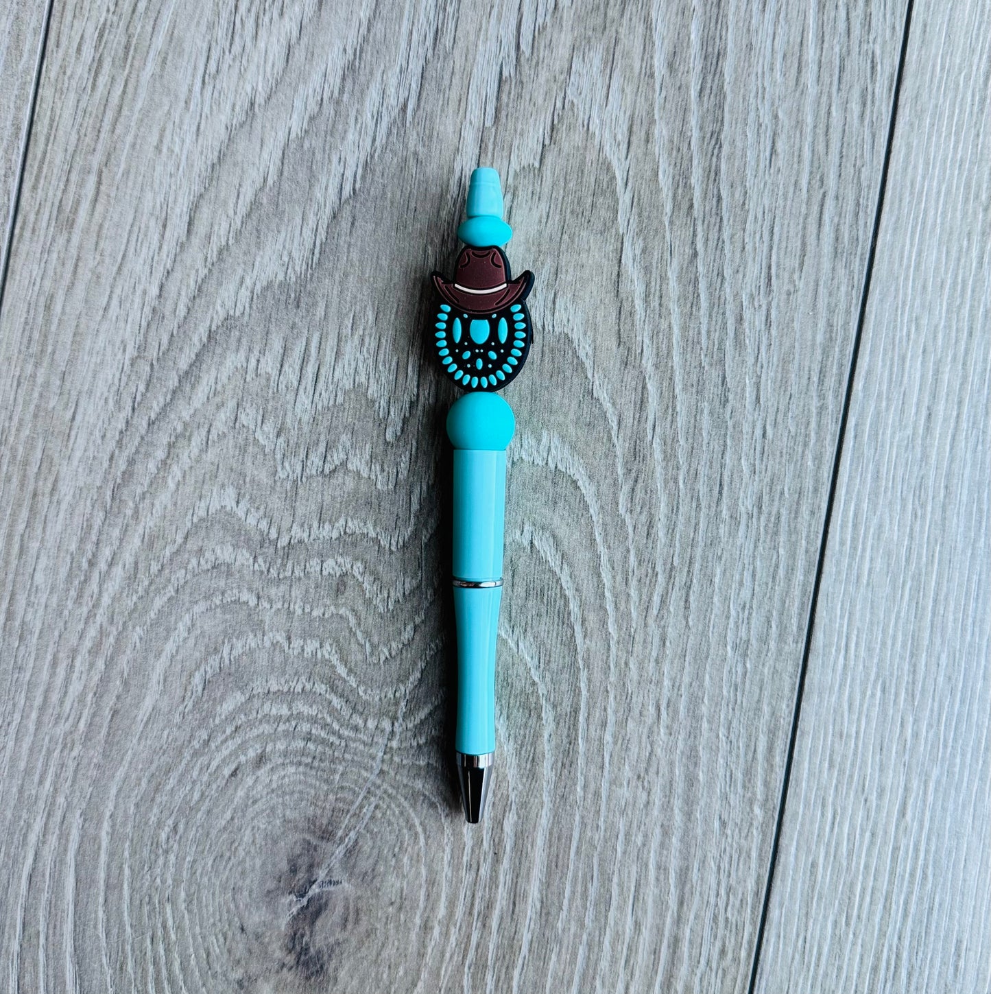 Turquoise with hat Pen